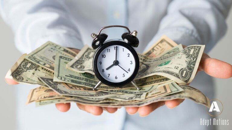 alarm clock sitting on pile of money