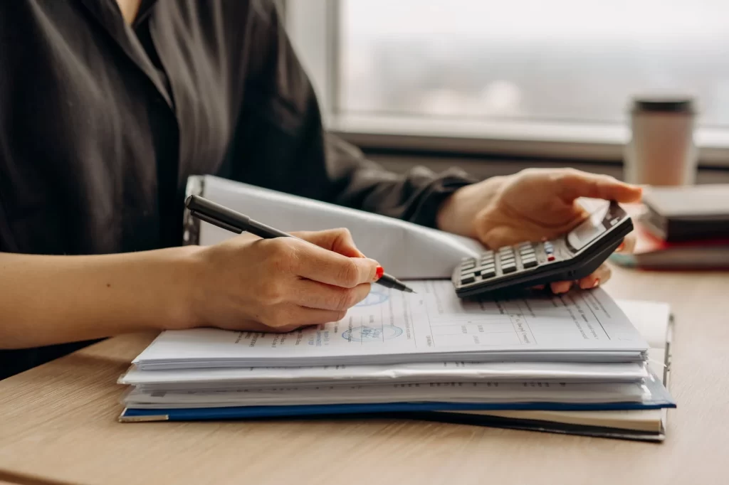 person working on their businesses financial records