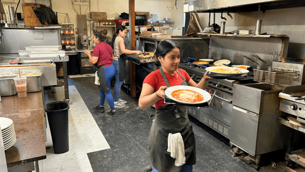 Kitchen Crew at Mamma Mia's Italian Restaurant in Abingdon, VA Working Hard and Together During Busy Dinner Rush.